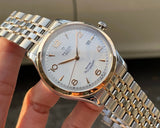 Tudor watch, hq720_9181dc82, gold and silver band, white face