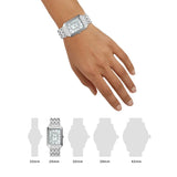 Silver rectangular watch on wrist with size comparison