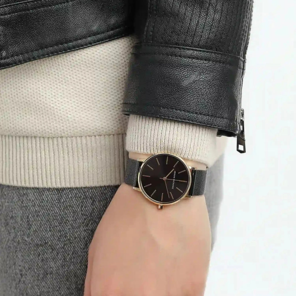 Michael Kors watch on wrist, leather jacket