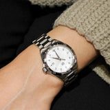 Stainless steel watch on wrist