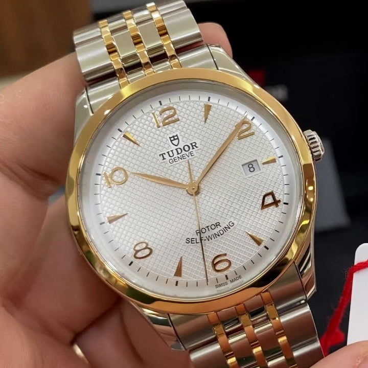 Tudor Geneve watch with gold accents