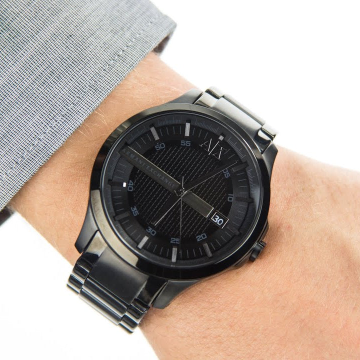 Armani Exchange black watch on wrist