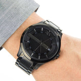 Armani Exchange black watch on wrist