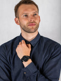 Man wearing Fossil Minimalist FS5308 black watch