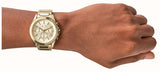 Gold watch on wrist