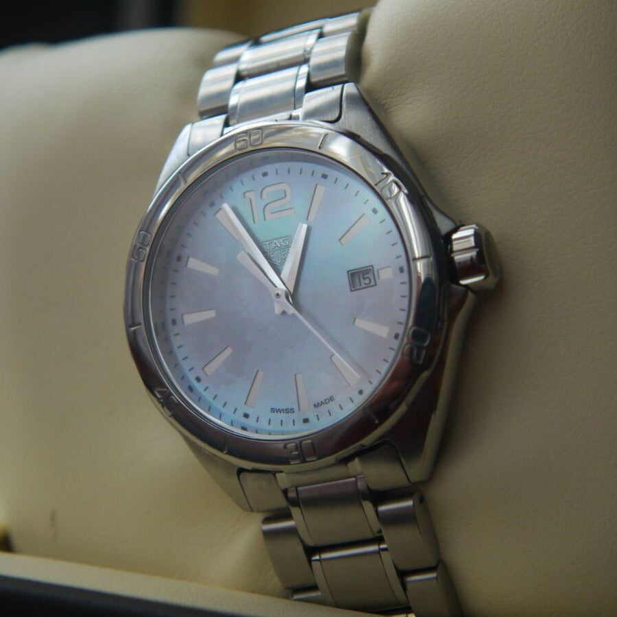 Stainless steel watch with mother-of-pearl dial