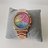 Guess rainbow watch on a pillow