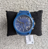 Blue Armani Exchange watch on black pillow