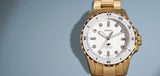 Fossil Blue watch poster - gold watch with white face