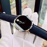 Movado watch with black face and leather band