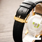 Black leather watch strap with gold buckle detail - 0607195-4-1712588512