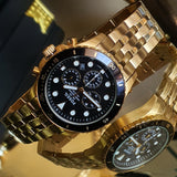 Gold Fossil watch with black face