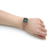 Wrist with a watch.