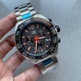 TAG Heuer watch with black and orange accents