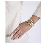 Gold wristwatch on wrist