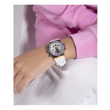 Wrist watch with white strap on wrist