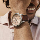 Man's wrist with watch, close-up.