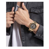 Guess GW0539G2 gold watch on wrist