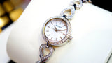 Bulova Analog Crystals Mother of Pearl Dial Silver Steel Strap Watch for Women - 98X109