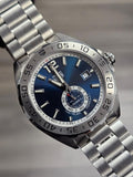 Silver wristwatch with blue face.