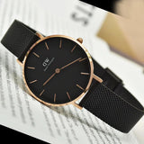 Black watch with rose gold accents.