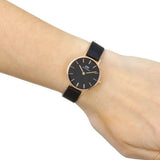 Wrist watch with black face and band.