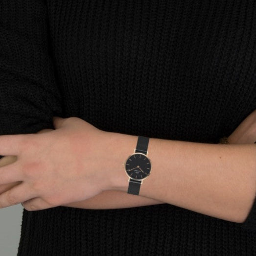 Black wristwatch on wrist