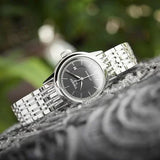 Tissot T085.207.11.051.00 watch with black dial and silver bracelet