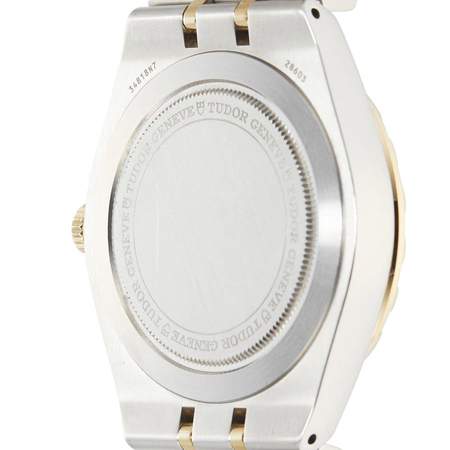 Back of a silver and gold wristwatch.