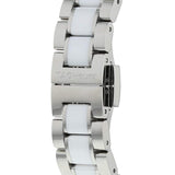 Close-up of a silver and white watch band with TAG Heuer engraved.