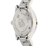 Silver wristwatch back with text.