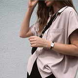 Woman wearing a pink shirt and watch, 41DmuT7uONL._AC