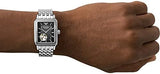 Armani watch on wrist, silver band, black face