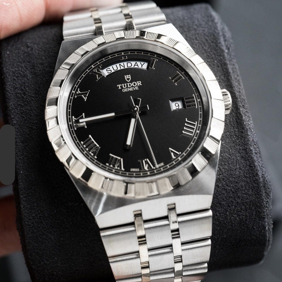 Tudor watch with black face and silver band, ref 44C9E44F-3857