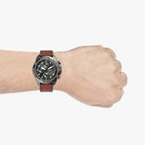 Brown leather watch on wrist, MODEL4