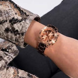 Rose gold watch on wrist