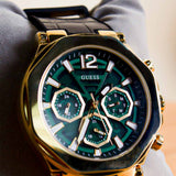 Guess watch with green face and gold accents