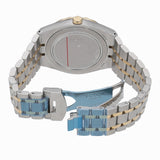Back of a silver and gold wristwatch.
