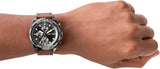 Man wearing a stylish watch on wrist.
