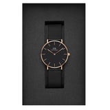 Black watch with gold accents in a box.