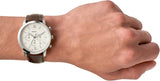Fossil watch on wrist with brown leather strap