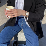 Woman in blazer and jeans holding coffee, 81mC9AXBm7L