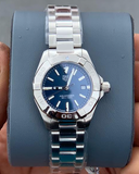 Tag Heuer Aquaracer watch with blue dial