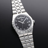 Tudor watch with black face and Roman numerals