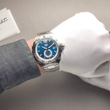 TAG Heuer watch with blue face on wrist