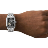 Armani watch 96532-b on wrist, black dial, silver band.