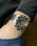 Wrist watch on a person's arm.