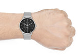 AX2714 Men's Watch on wrist with black dial and mesh band.