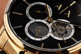 A|X watch detail with gold accents and black face