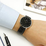 Daniel Wellington black watch on wrist